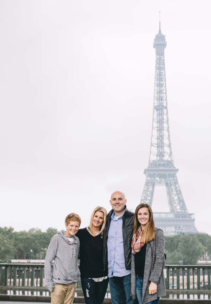 Happy family near Eiffel Tower