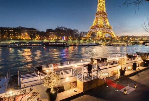 Cozy dinner in Paris at night in front of Eiffel Tower